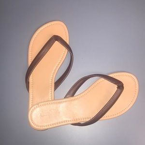 Brown flip flops